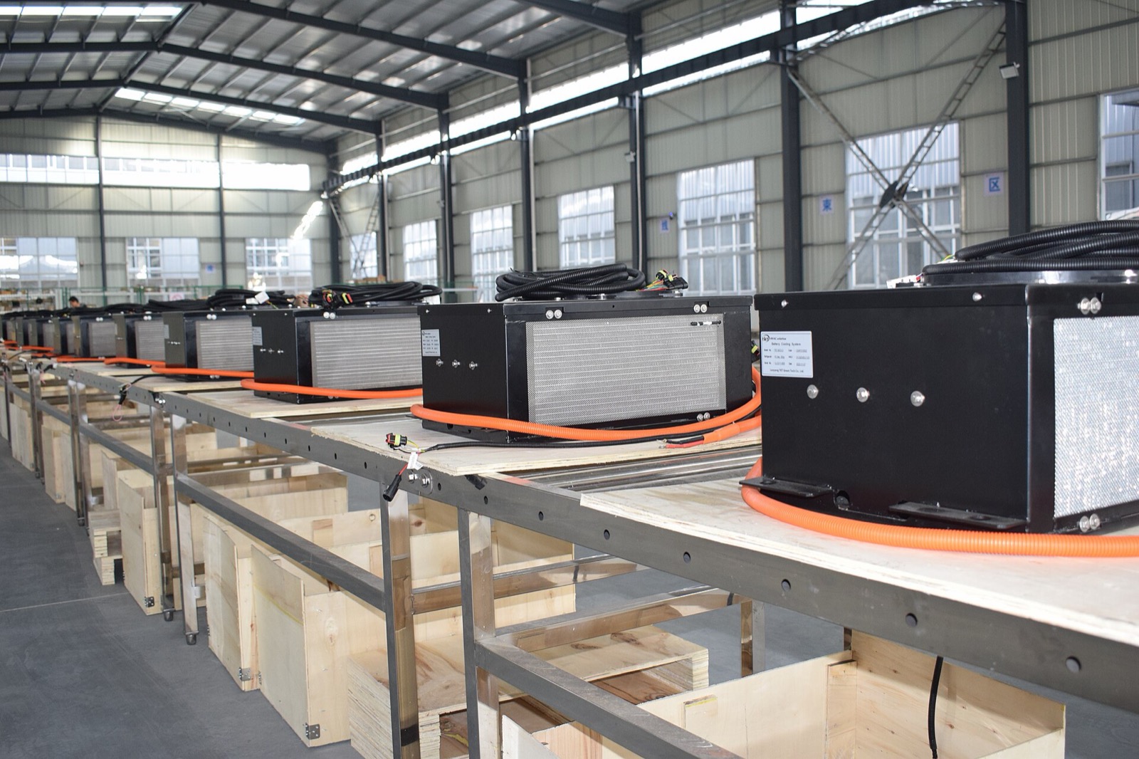 Battery thermal management hardware — a bank of integrated battery cooling units, the kind of subsystem that BYD designs and builds in-house, paired with its own compressors and heat pump, to enable refrigerant direct cooling on the blade pack.