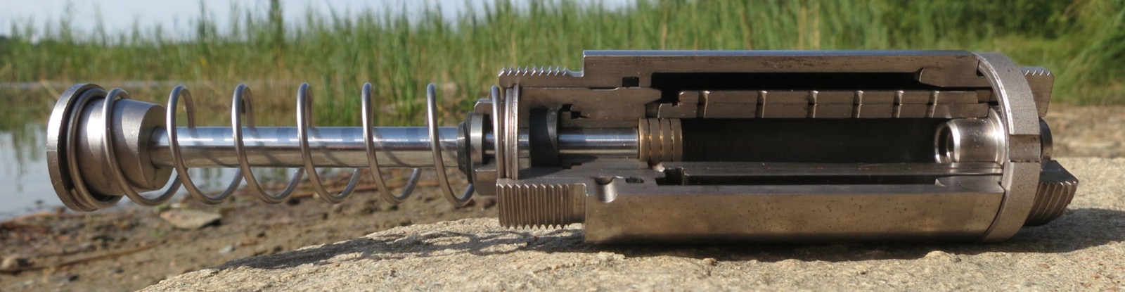 A cutaway demonstration shock absorber showing the piston, spring and internal valving — the physical hardware on which FSD, CDC and MRC variable-damping systems are built.