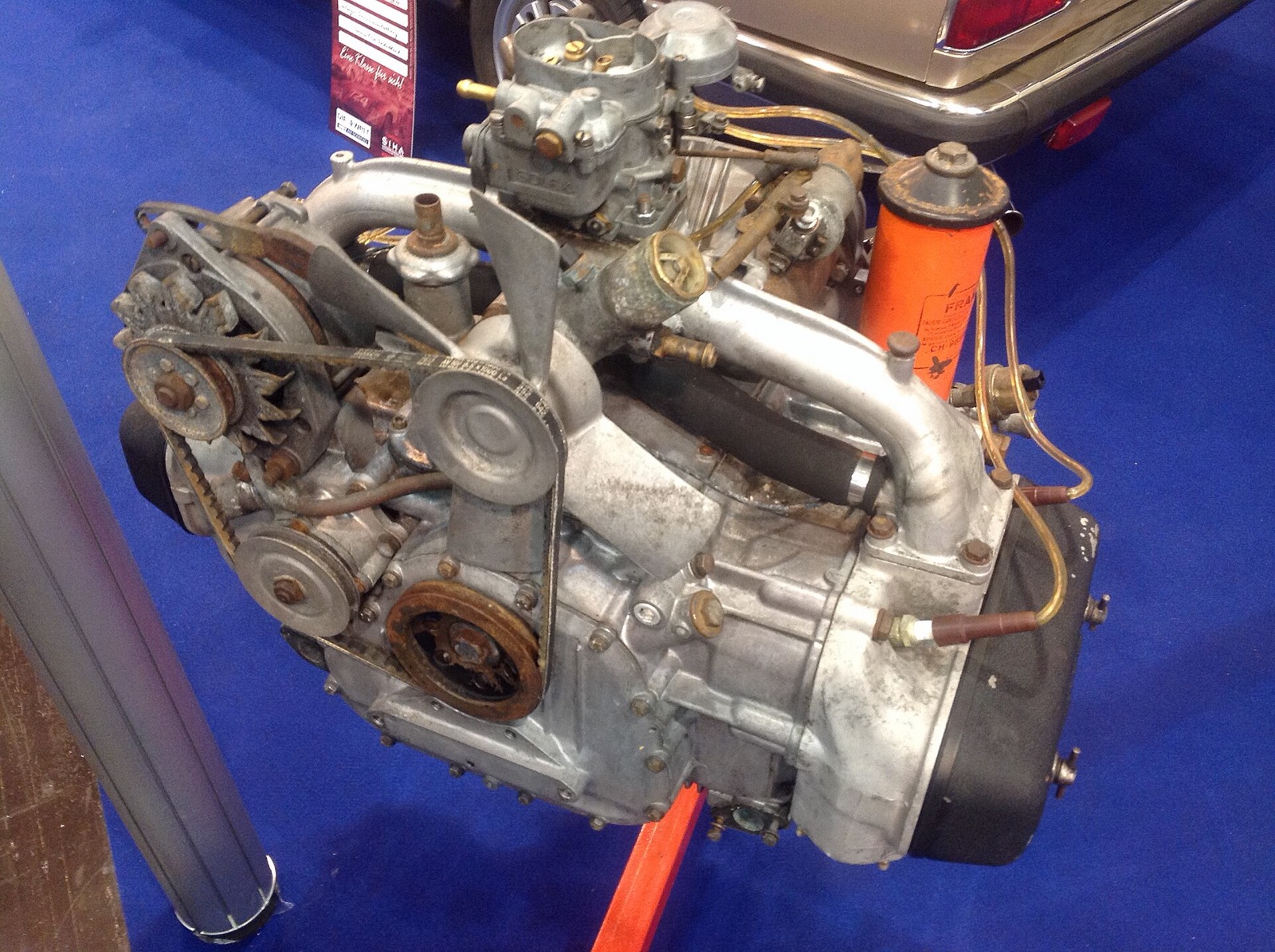 A Lancia Flavia flat-four (boxer) engine, a 1960s-70s example of the same horizontally-opposed layout BYD has now put on a modern EV platform. The defining feature of a boxer — and the reason it frees up vertical space — is that the pistons move sideways, not up and down, halving the engine's height.